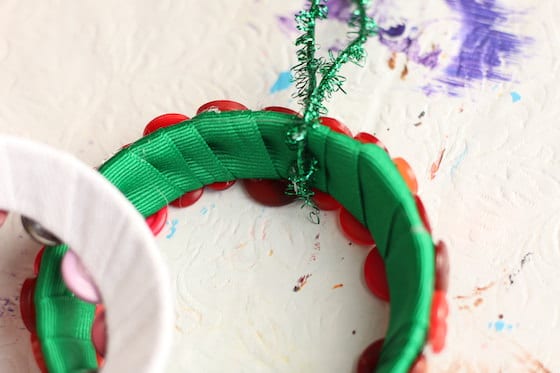 close up green ribbon wrapped around mason lid ring