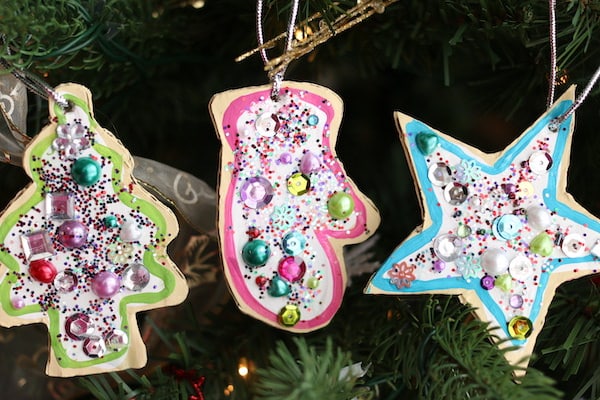 horizontal image tree mitt and star sugar cookie ornaments on Christmas tree