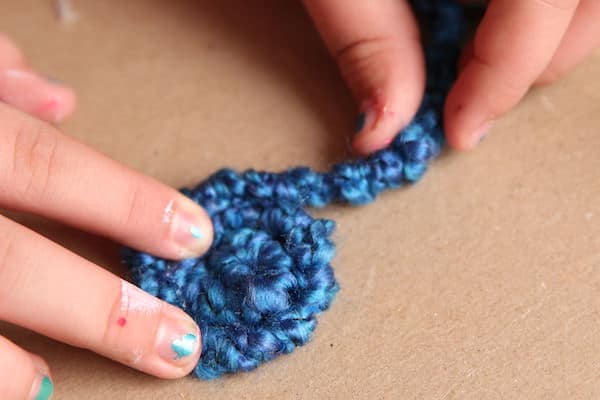 coiling yarn wrapped pipe cleaner