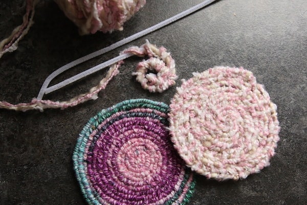 purple/blue trivet, pink coaster, pipe cleaners wrapped in yarn