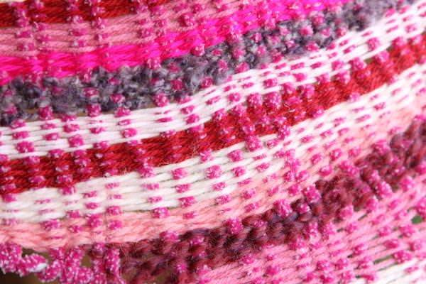 close up pink weaving on coat hanger