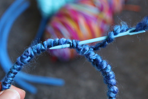 weaving tail end yarn into pipe cleaner dining