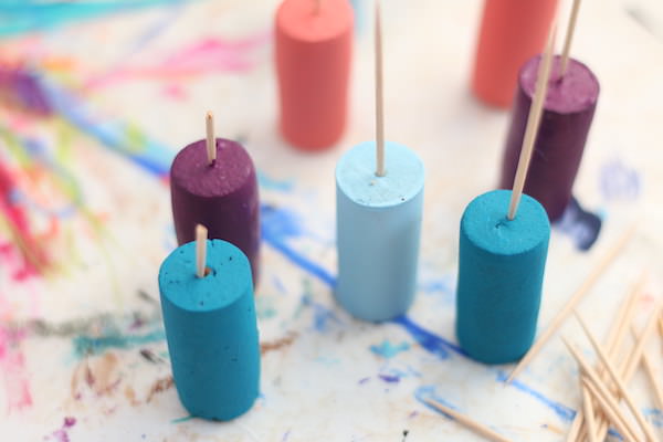 painted corks with toothpicks in tops