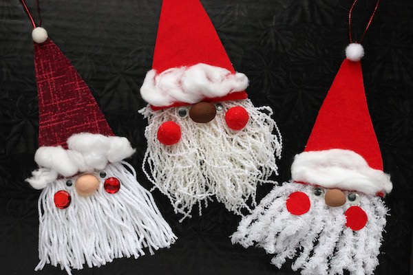 cardboard santa craft with fabric hat and yarn beard  