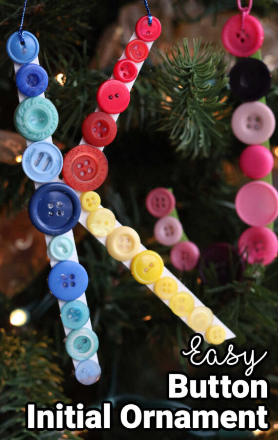 cardboard and button initial ornaments hanging on Christmas tree