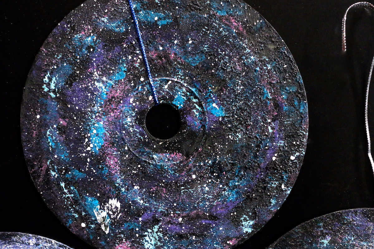 CD painted to look like a galaxy