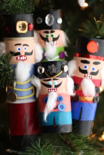 Toilet paper roll and paper towel roll nutcrackers huddled together on Christmas tree