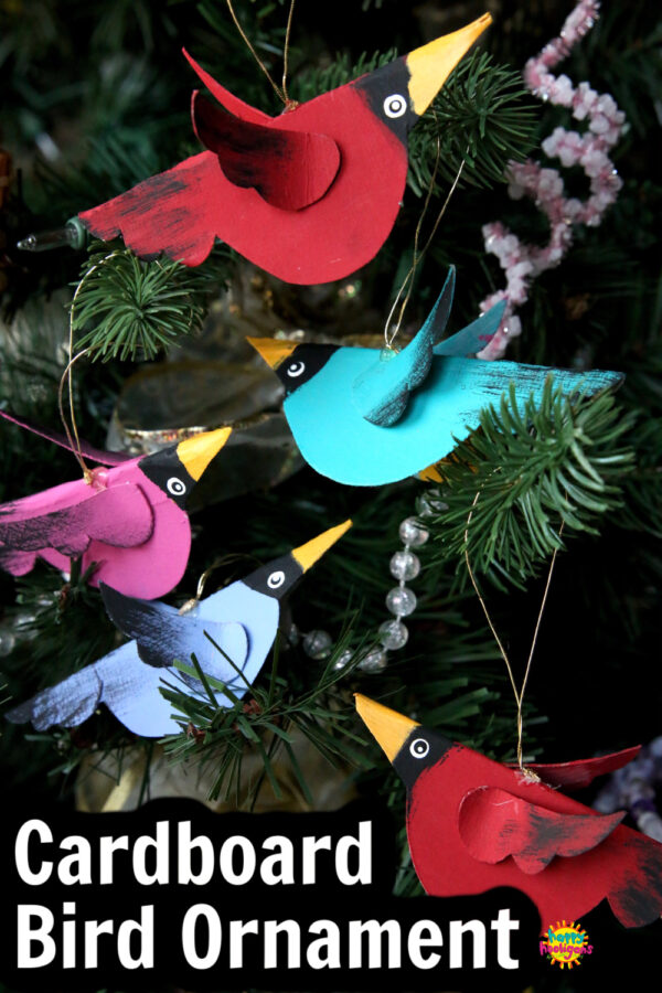 Colourful Cardboard Birds hanging on Christmas Tree