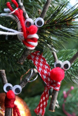 3 twig reindeer with scarves on christmas tree