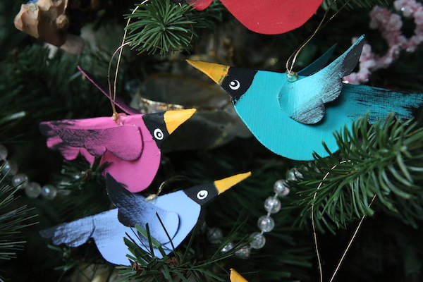 pink, blue and purple cereal box birds hanging on Christmas tree
