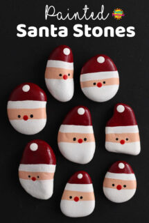 8 simple santa faces painted on smooth beach stones