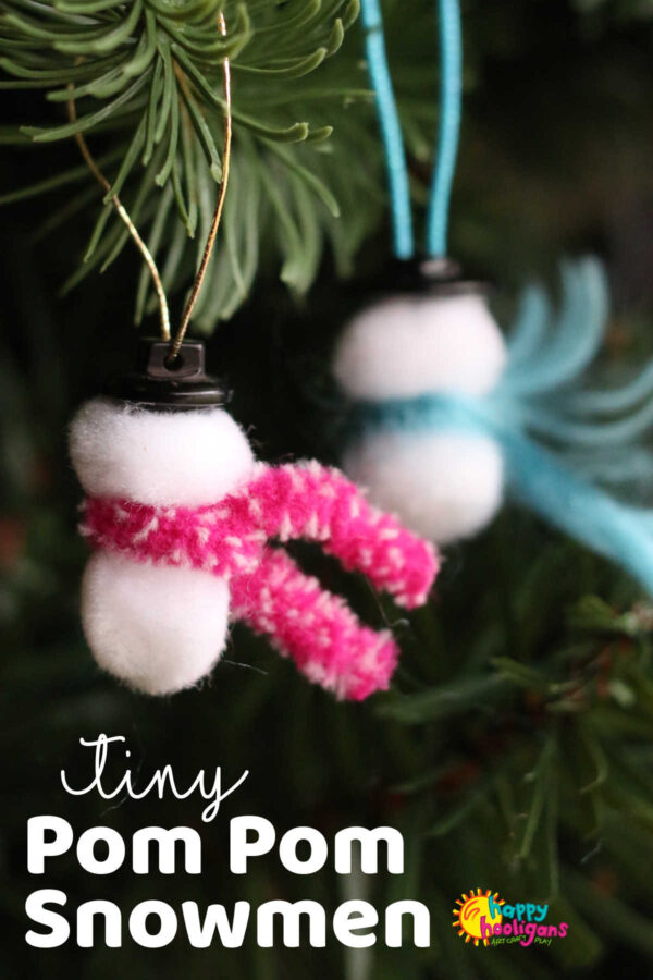 tiny pom pom snowmen hanging on Christmas tree