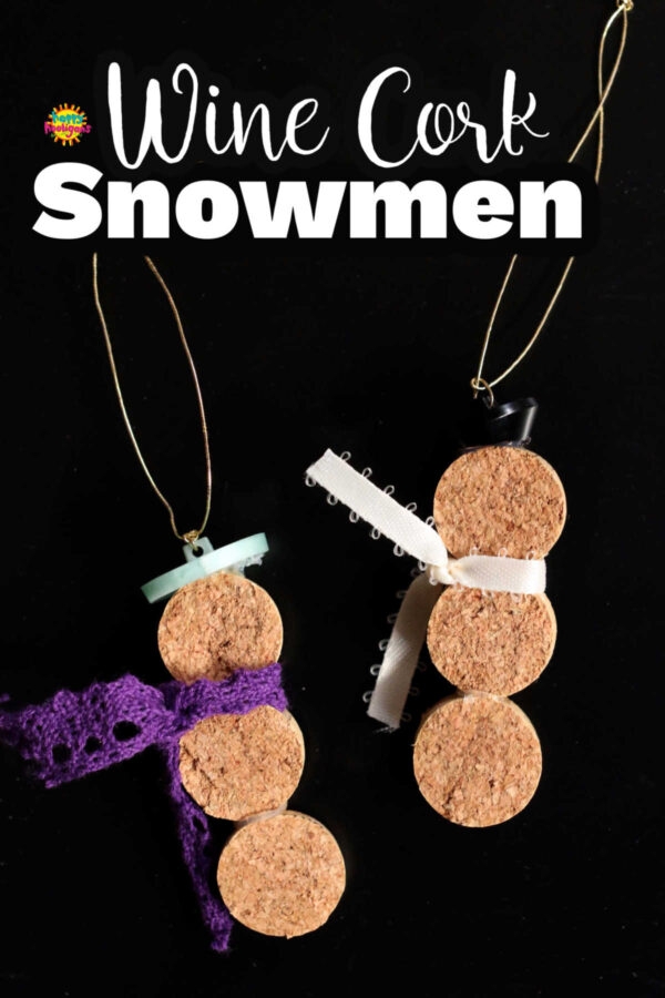 2 faceless snowman ornaments made with wine cork slices with button hats and ribbon scarves